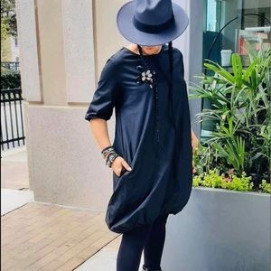 Dress fits L/XL arm area not as loose fitting as the rest of the dress